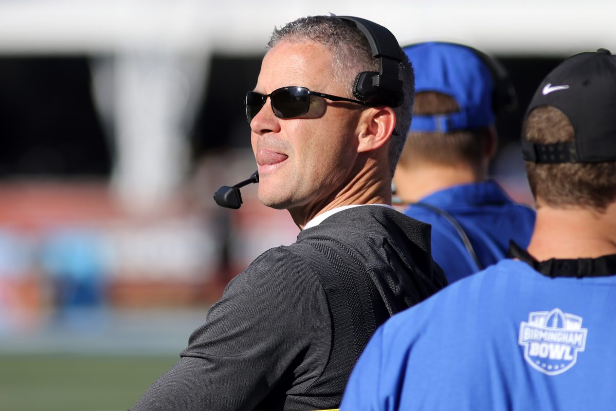 Mike Norvell stands on the sidelines during a game