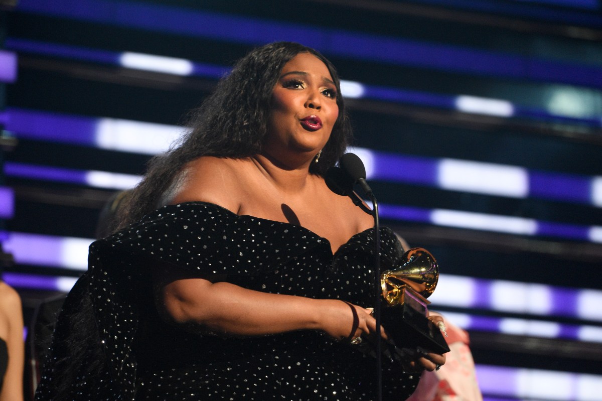 Lizzo accepting a Grammy Award