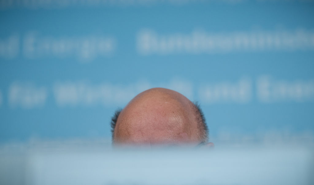 The bald head of German Economy Minister Peter Altmaier is pictured as he holds a press conference about the new amendment of the Foreign Trade and Payments Act and the overall economic development, in Berlin, on April 8, 2020, in the context of the novel coronavirus COVID-19 pandemic. (Photo by MICHAEL KAPPELER/POOL/AFP via Getty Images)