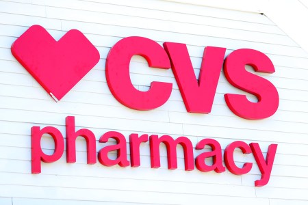 A sign on the side of the CVS Pharmacy on May 15, 2020 in Carver, Massachusetts. (Photo by Maddie Meyer/Getty Images)