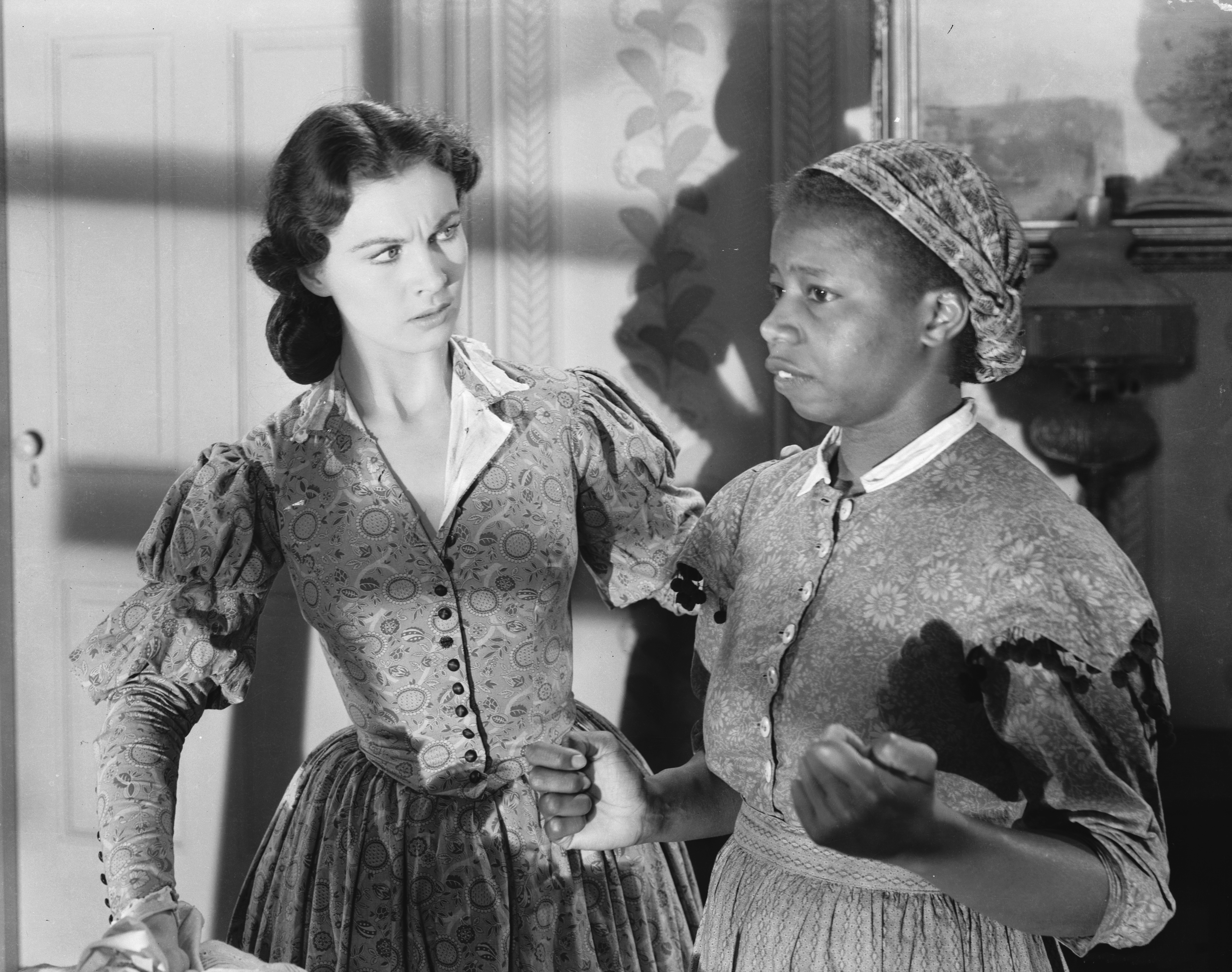 British actress Vivien Leigh with Butterfly McQueen in a scene from the American civil war epic 'Gone With the Wind'.  (Photo via John Kobal Foundation/Getty Images)
