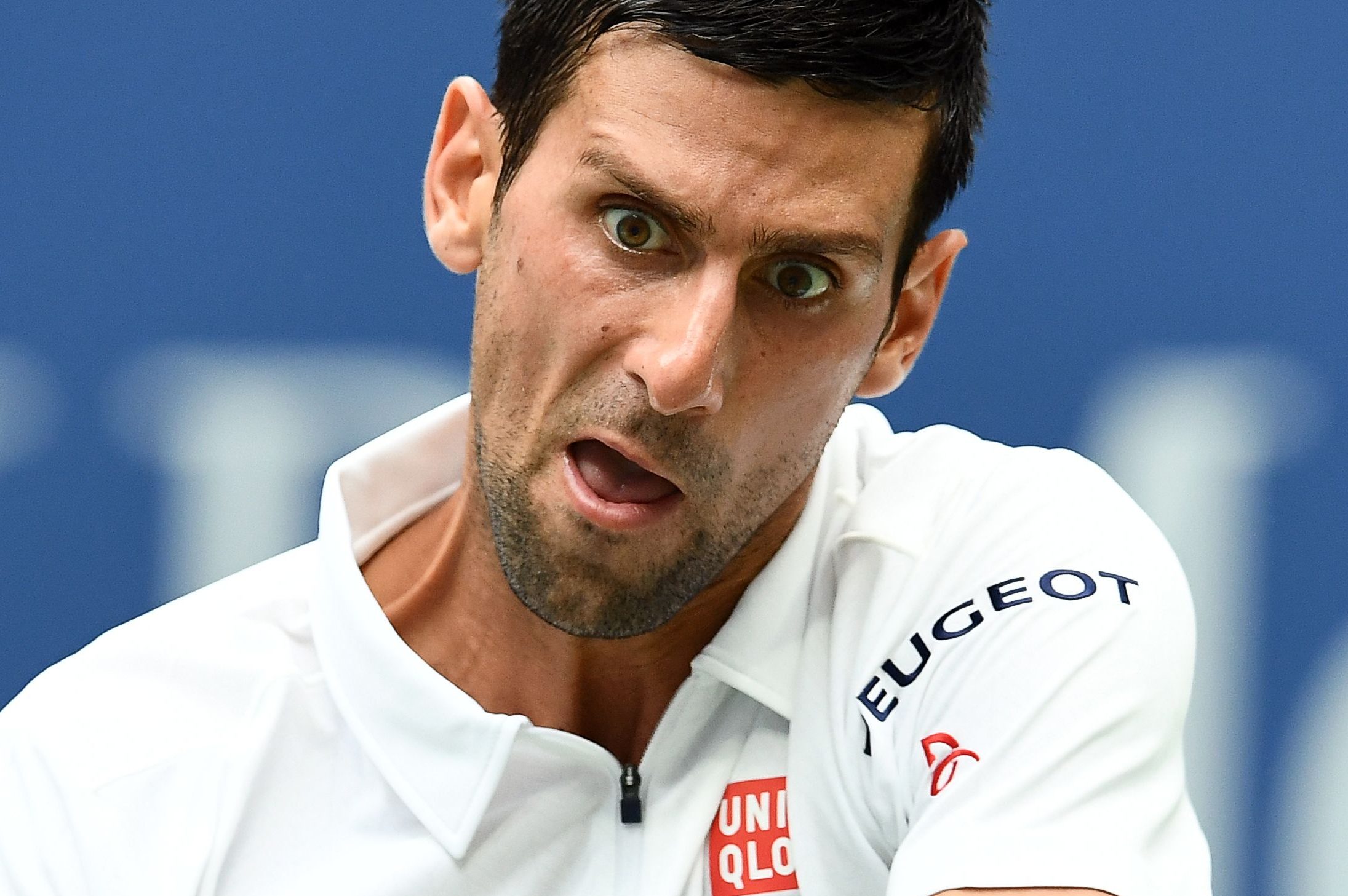 Novak Djokovic hits a tennis ball