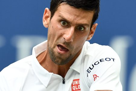 Novak Djokovic hits a tennis ball