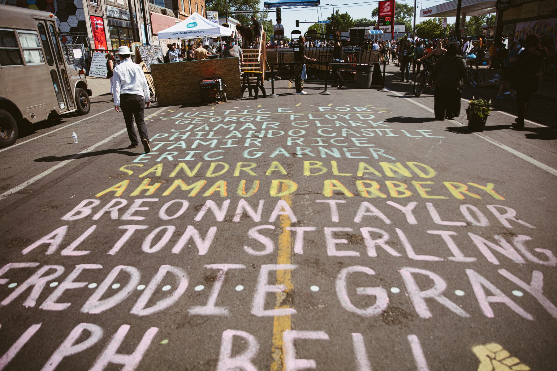 A list of Black victims of police, white supremacist and other violence painted on the street.