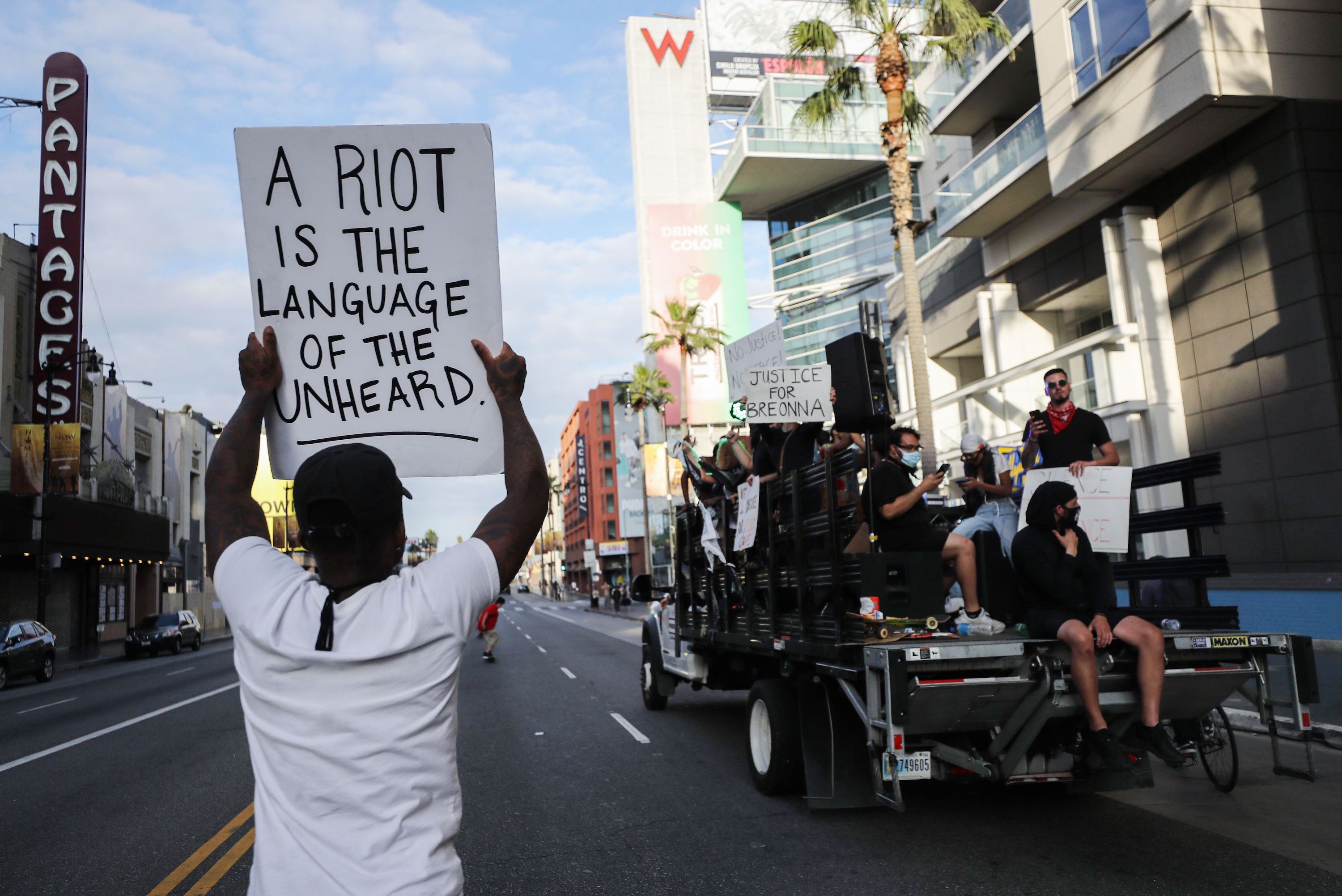 A man protests police brutality in Los Angeles