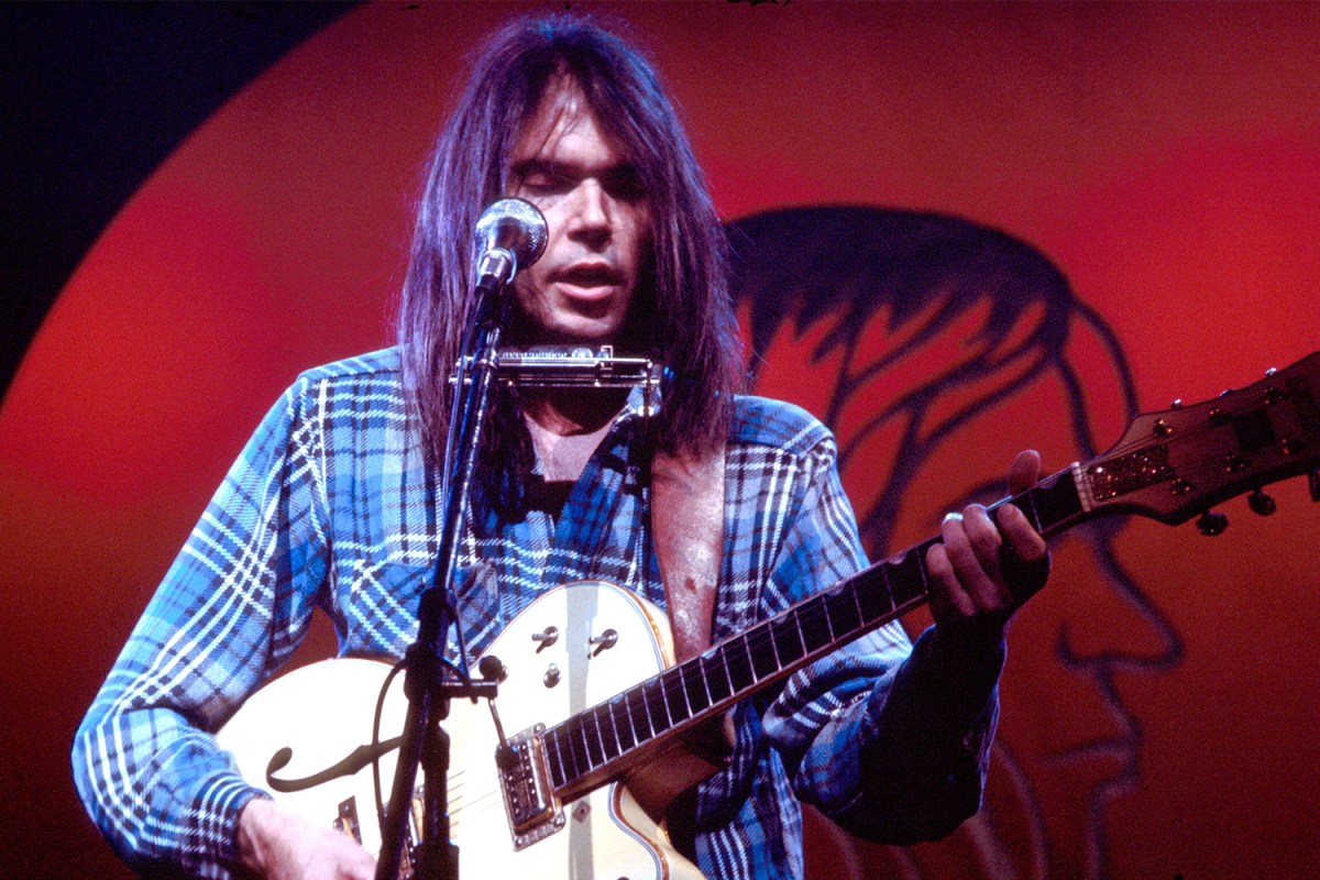 Neil Young performs on stage at Hammersmith Odeon, London, 28th March 1976