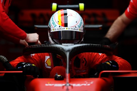 Sebastian Vettel sits in his car before a race