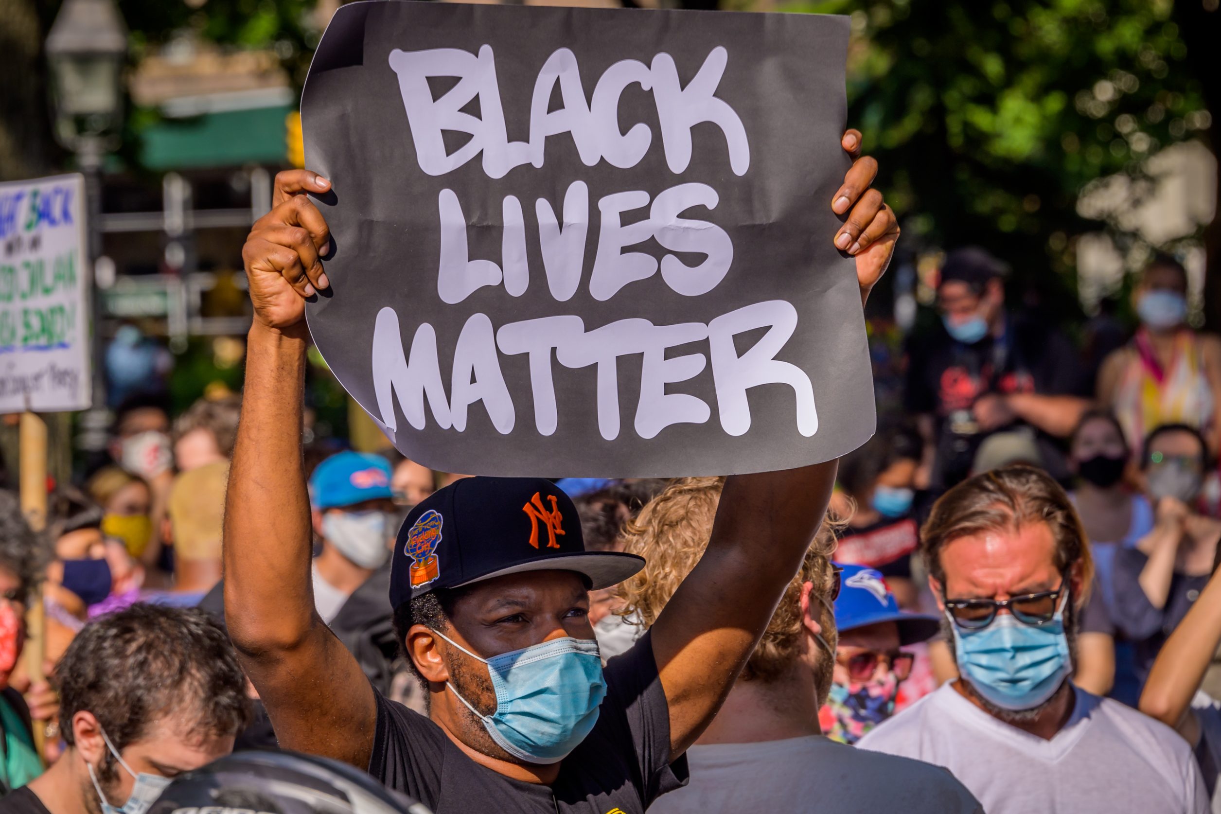 A participant holding a Black Lives Matter sign at the