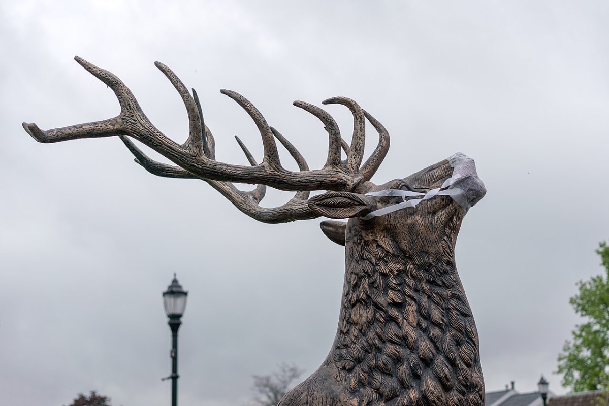 Elk statue with facemask