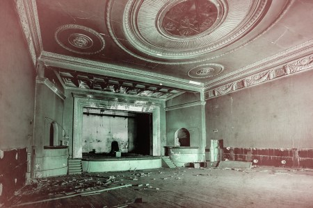 Old burnt creepy abandoned ruined haunted theater.
