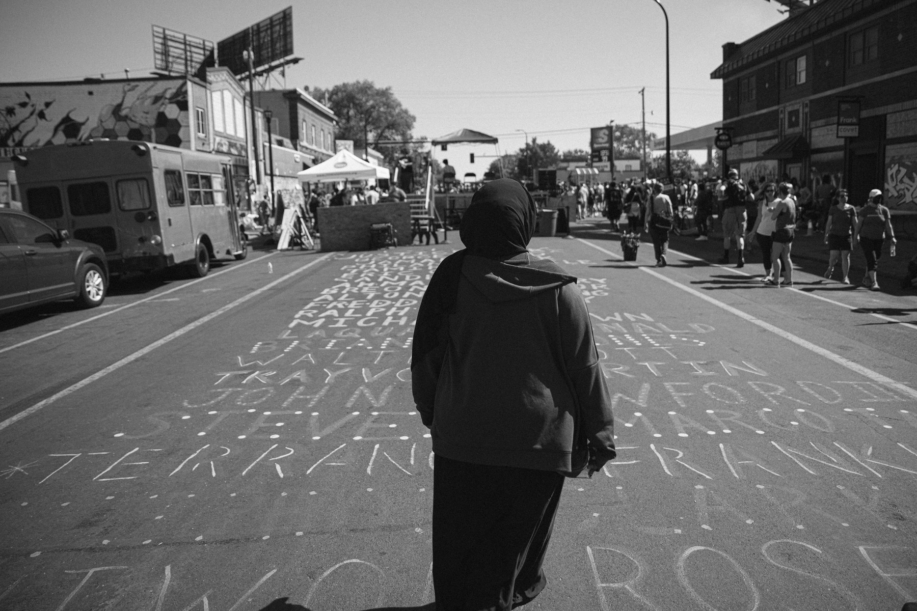 Walking across the names of George Floyd, Jamar Clark, Sandra Bland, Breonna Taylor and others.