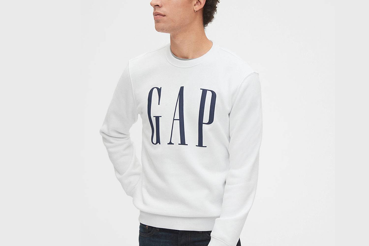 Man wearing a classic Gap logo sweatshirt in white and navy