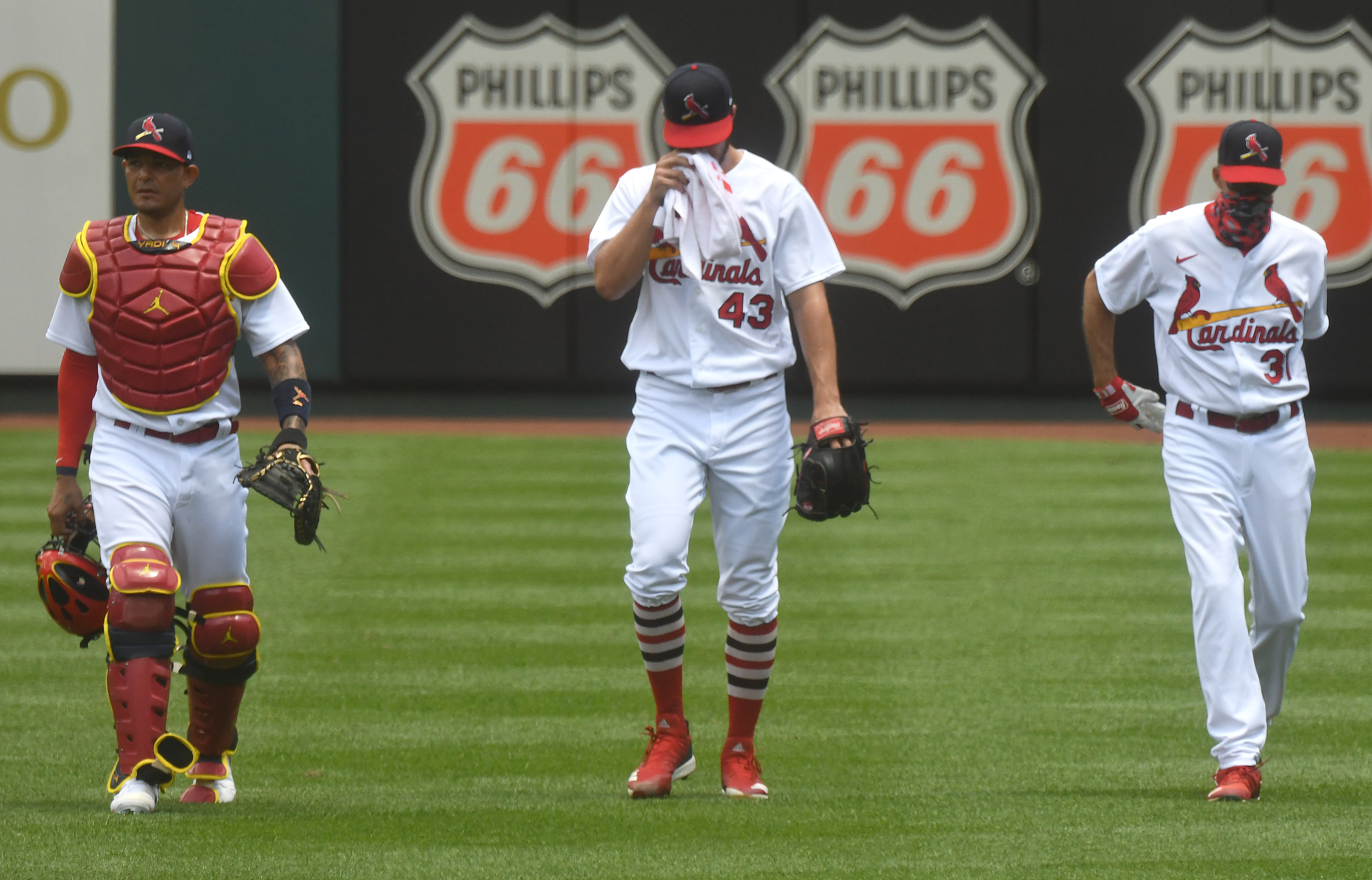 From left, St. Louis Cardinals catcher Yadier Molina, starting pitcher Dakota Hudson and pitching coach Mike Maddox make their way to the dugout after warming up before a Major League Baseball game between the Pittsburgh Pirates and the St. Louis Cardinals, on July 26, 2020, at Busch Stadium, St. Louis, MO. (Photo by Keith Gillett/Icon Sportswire via Getty Images)