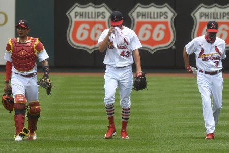 From left, St. Louis Cardinals catcher Yadier Molina, starting pitcher Dakota Hudson and pitching coach Mike Maddox make their way to the dugout after warming up before a Major League Baseball game between the Pittsburgh Pirates and the St. Louis Cardinals, on July 26, 2020, at Busch Stadium, St. Louis, MO. (Photo by Keith Gillett/Icon Sportswire via Getty Images)