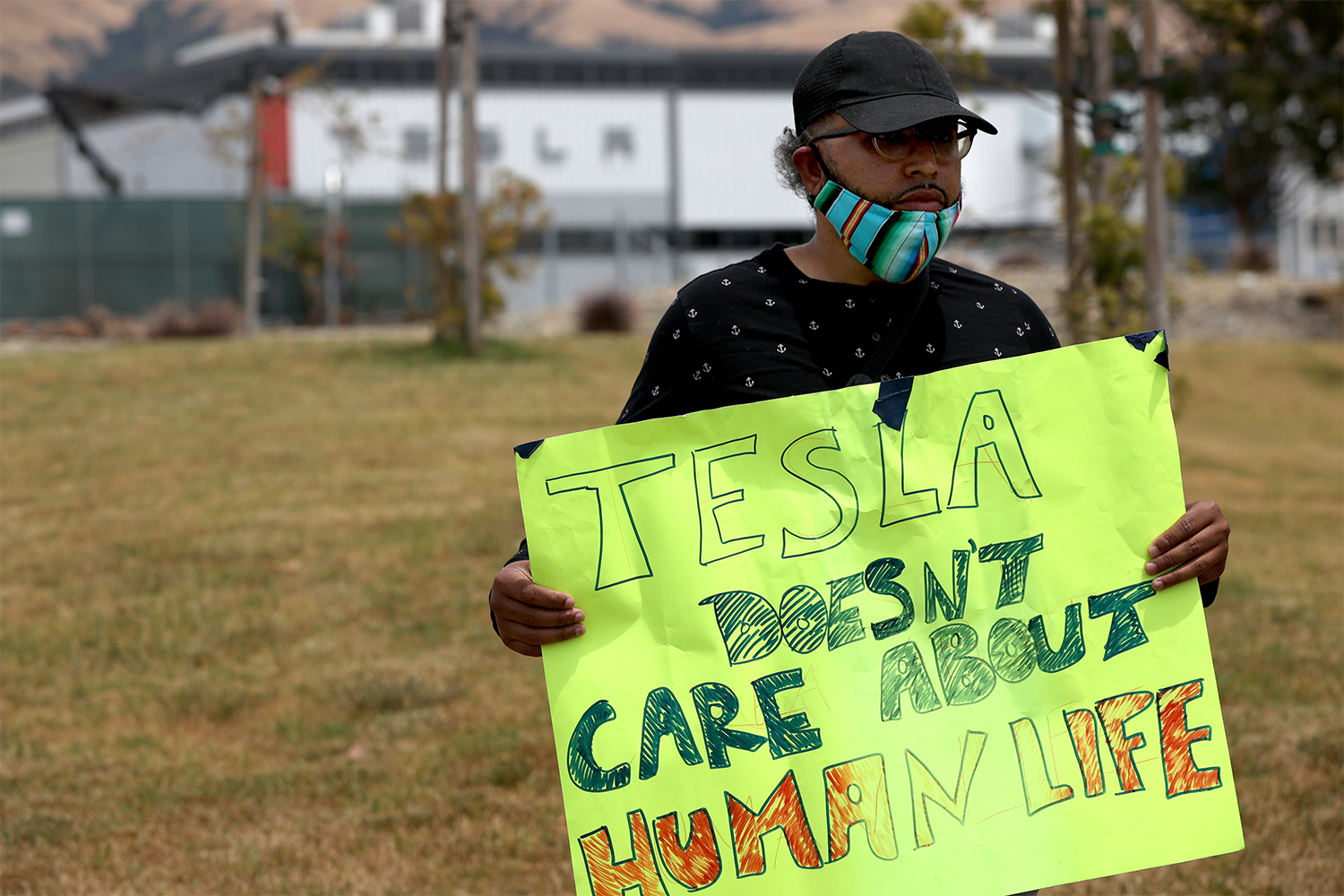 Former Tesla employee Carlos Gabriel protesting outside the Fremont factory on June 15.