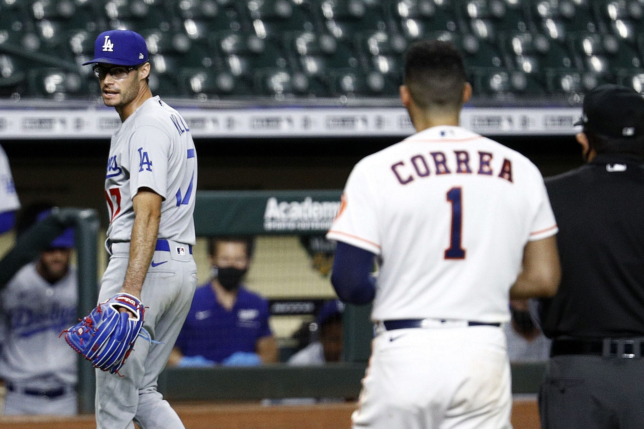 Joe Kelly of the Dodgers has a word with Carlos Correa of the Astros. (Bob Levey/Getty)