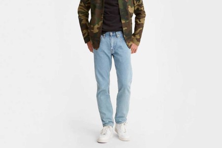 Man wearing a pair of Levi's 502 Taper Fit jeans