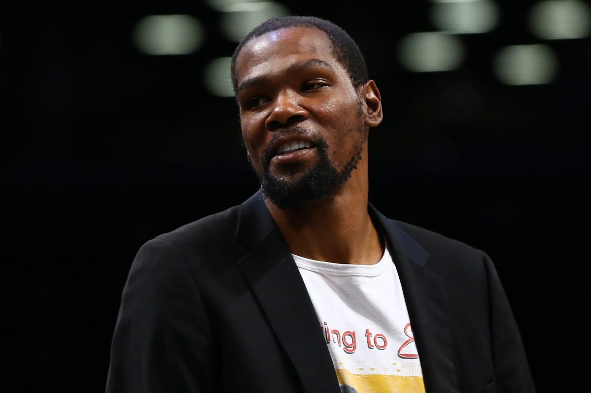 Kevin Durant of the Brooklyn Nets looks on from the bench in February. (Mike Stobe/Getty)