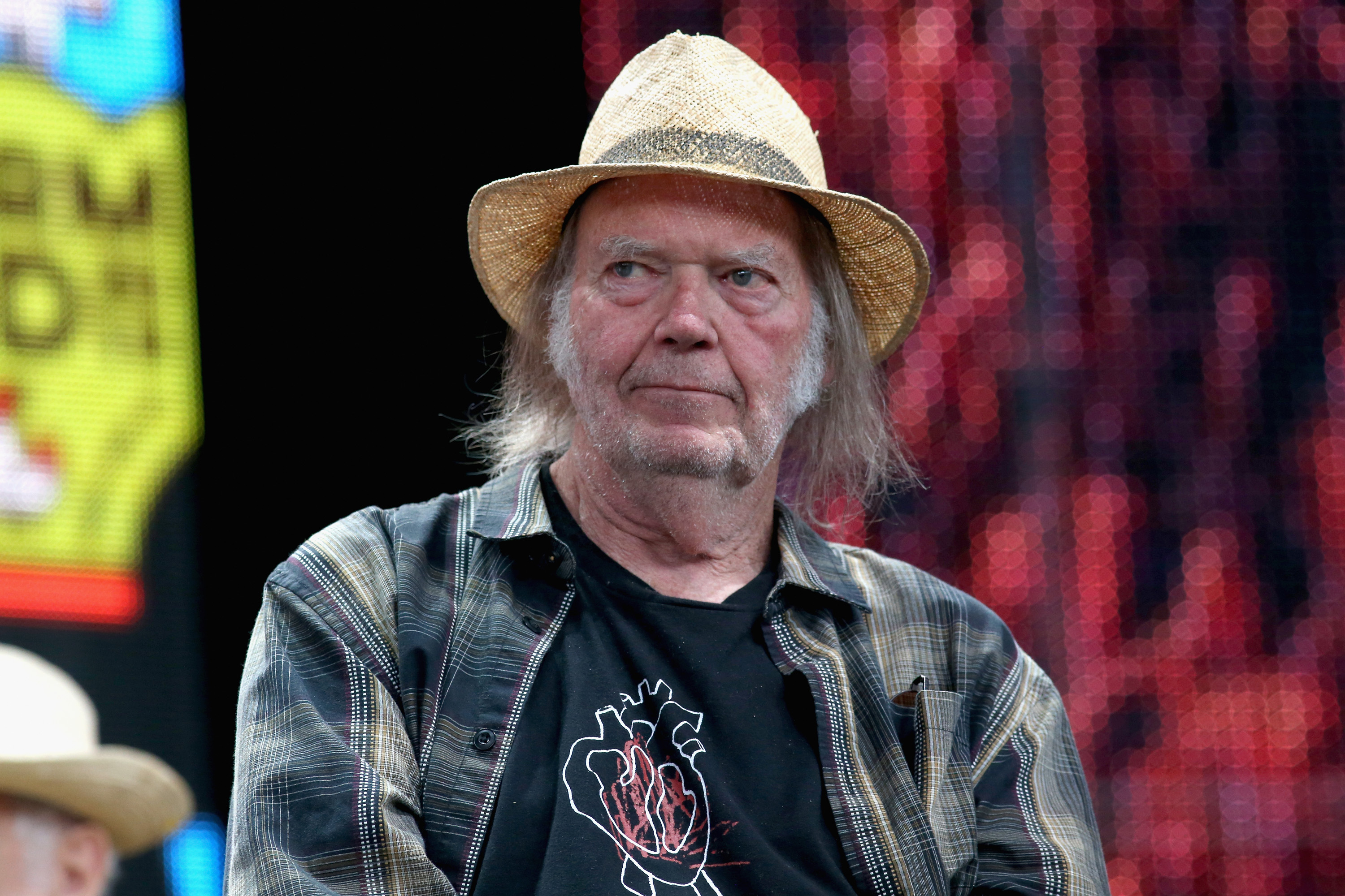 Neil Young attends a press conference for Farm Aid 34