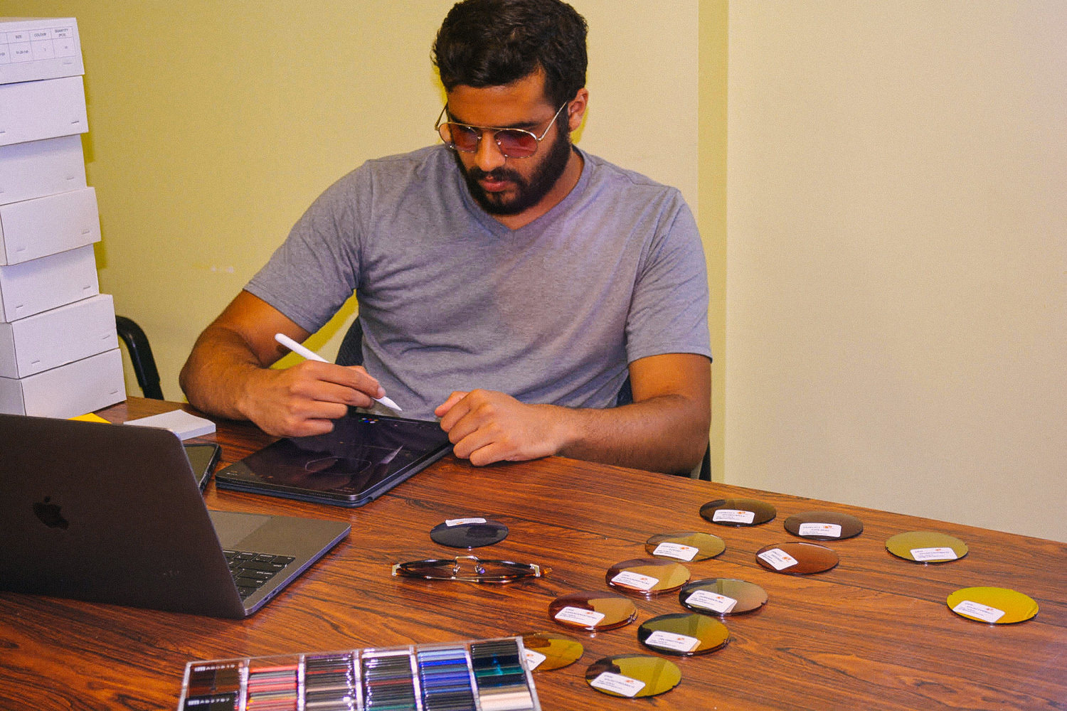 Akshar H. Patel of sunglasses company Bold Dots working at his desk