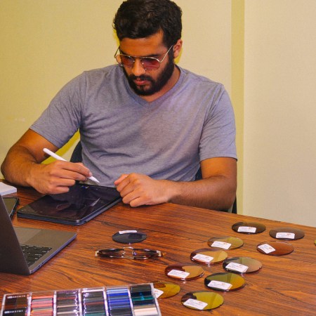 Akshar H. Patel of sunglasses company Bold Dots working at his desk