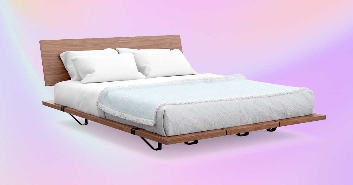 The Bed Frame from DTC furniture brand Floyd on a pink/purple background
