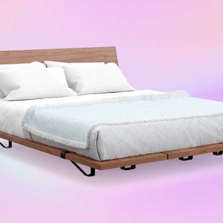The Bed Frame from DTC furniture brand Floyd on a pink/purple background