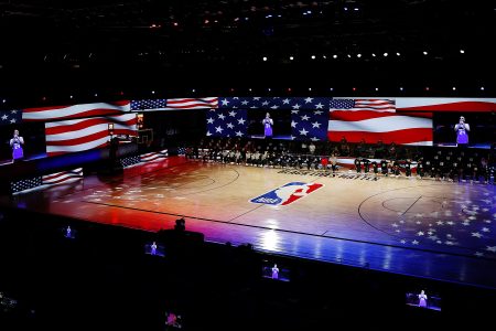 The Pelicans and Kings during the National Anthem prior to the start of a game