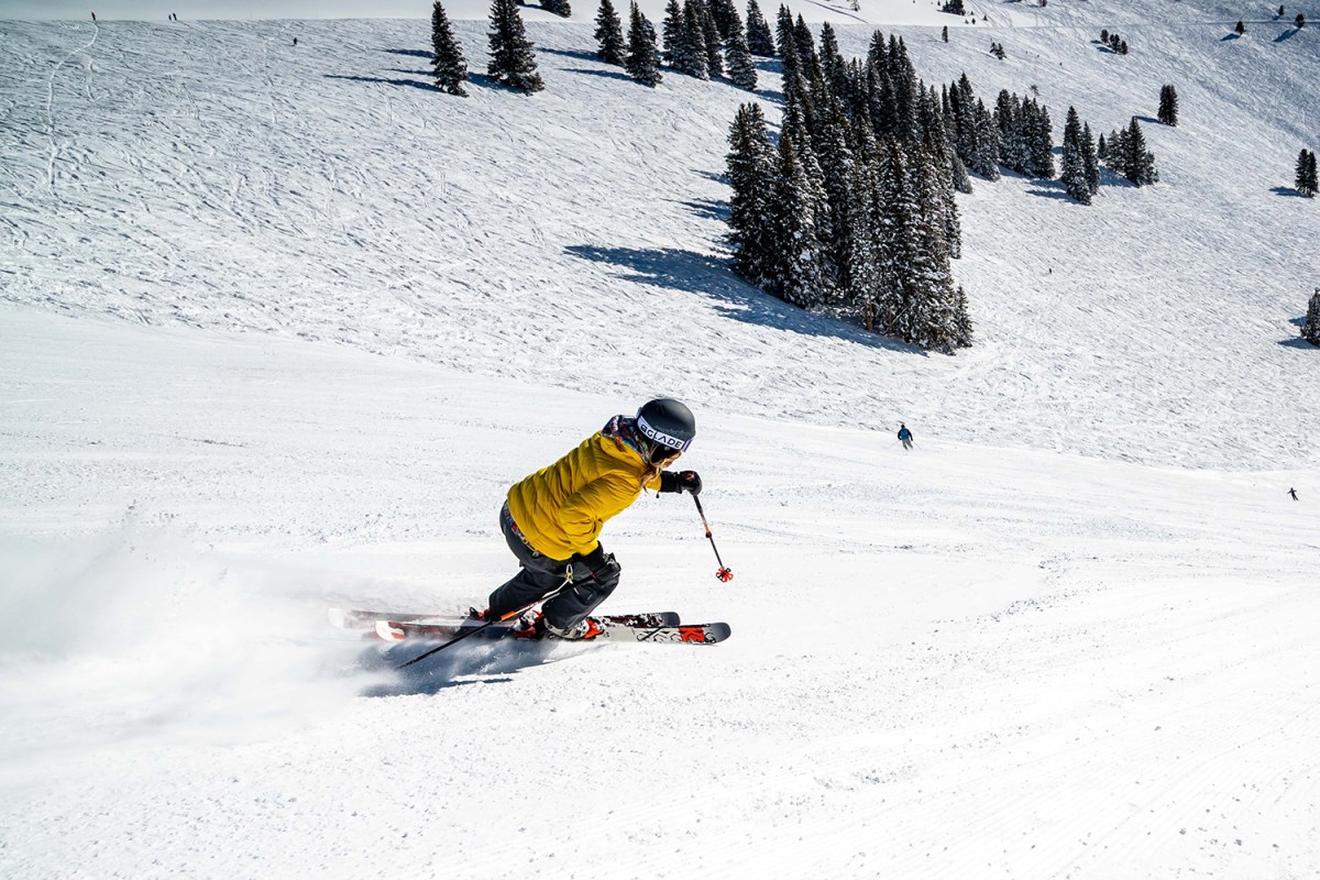 Skier in yellow skiing down a mountain in Vail, Colorado