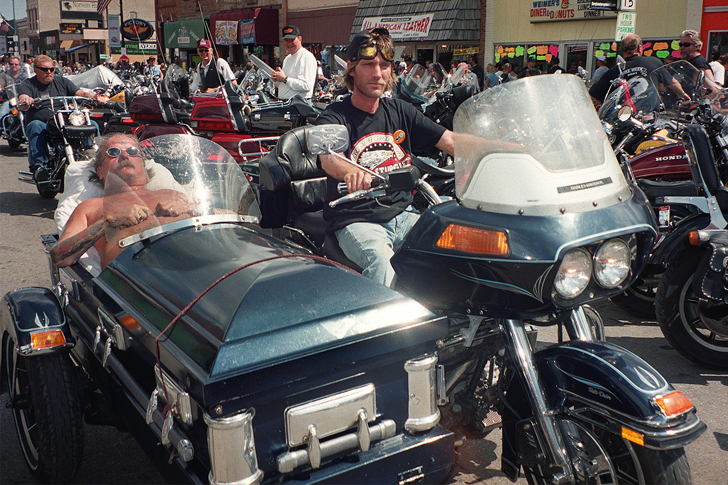 Two bikers at Sturgis in South Dakota in 2001, one in a coffin sidecar