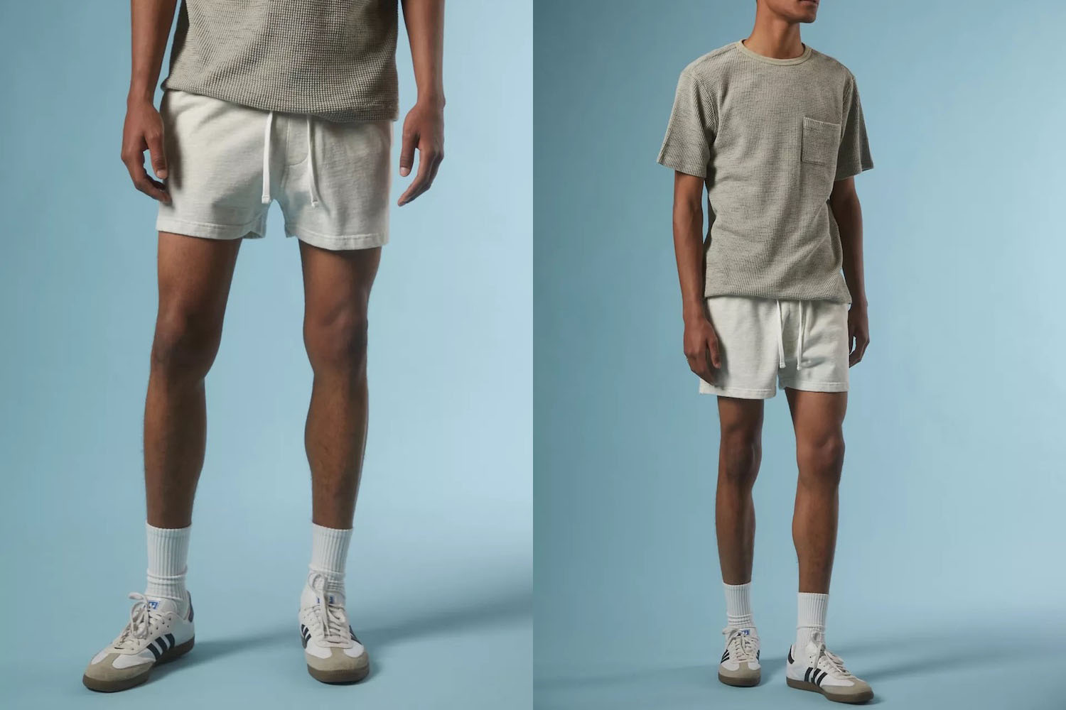 two model shots of the UO Lucien Shorts on a blue background