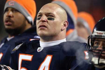 Brian Urlacher looks on from the bench area during a 2008 game in Chicago.