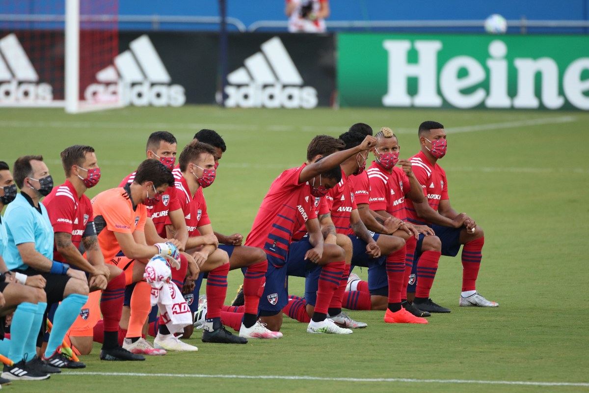 FC Dallas players kneel during the national anthem