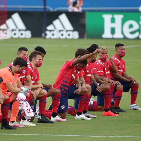 FC Dallas players kneel during the national anthem