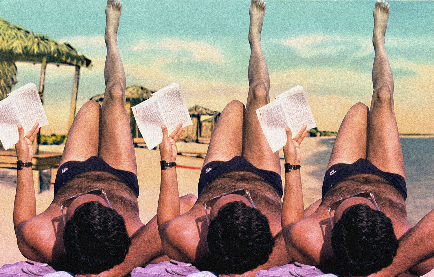Man reading on the beach during summer