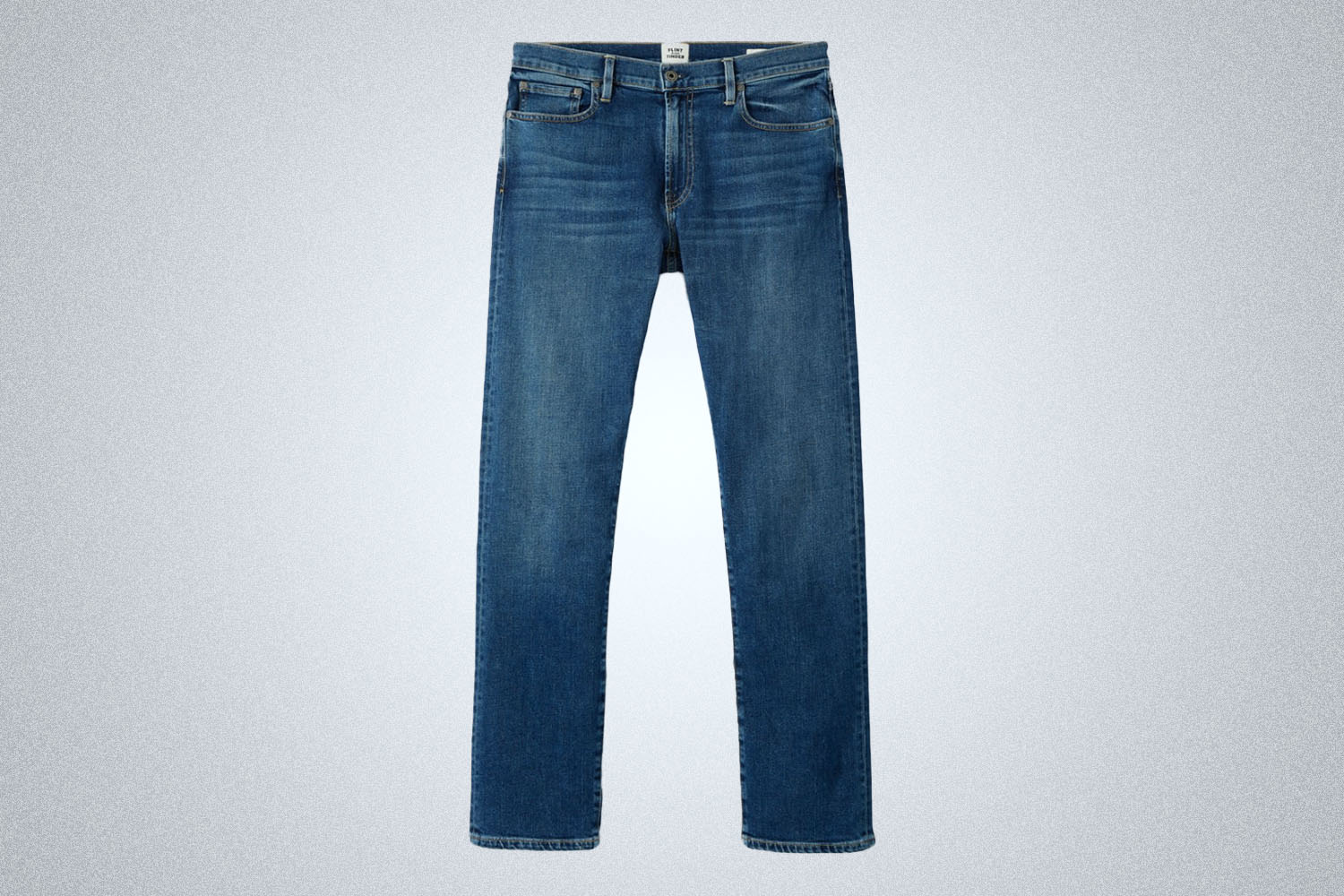 a pair of slight medium blue denim jeans
