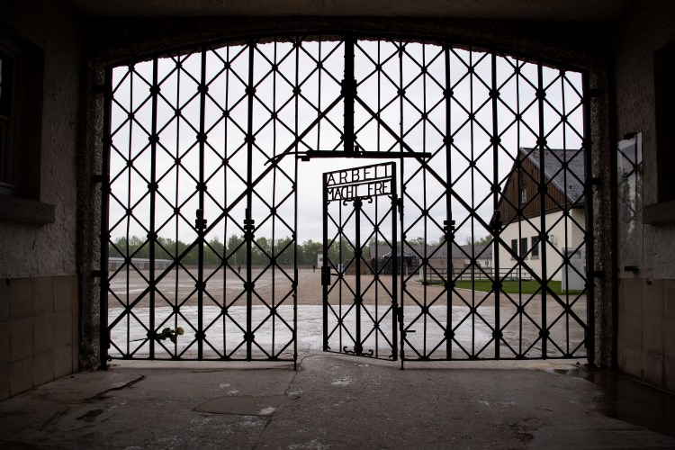 The entrance gate with the inscription "Arbeit macht frei" can be seen at the Dachau concentration camp memorial site. US soldiers liberated more than 30,000 people imprisoned in the camp on April 29, 1945. (Photo by Sven Hoppe/picture alliance via Getty Images)