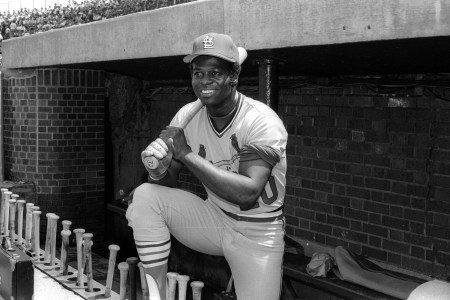 Lou Brock poses in the dugout.