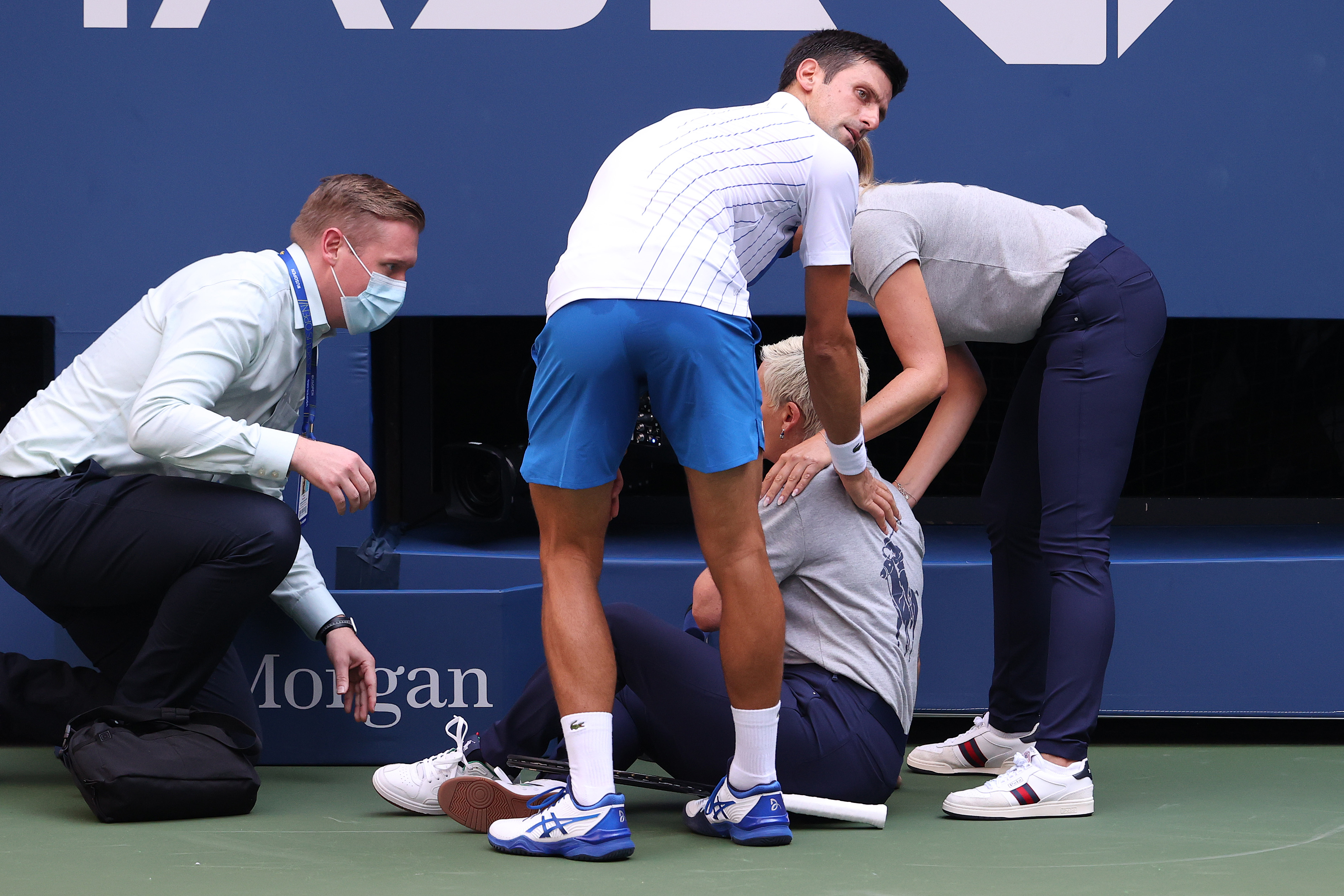 Novak Djokovic checks on Line Judge