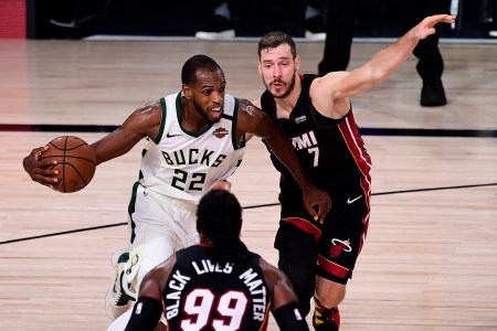 Khris Middleton drives against Goran Dragic