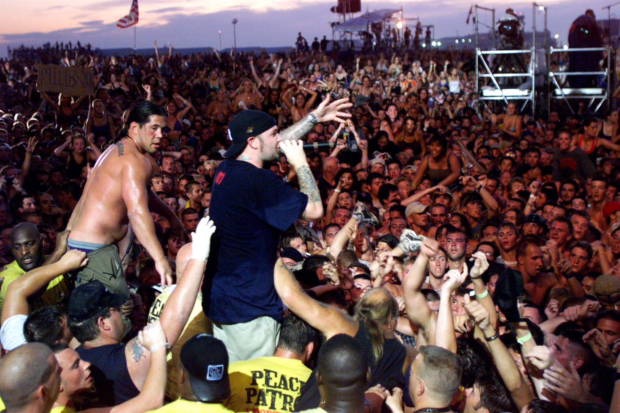 Limp Bizkit's Fred Durst brings his performance to the head of the crowd of the east stage Saturday at Woodstock '99 in Rome, New York