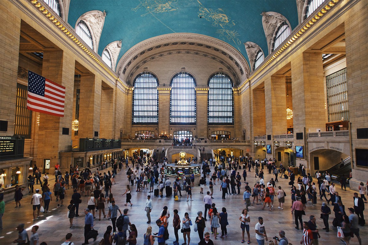 People walking around Grand Central Terminal during the day