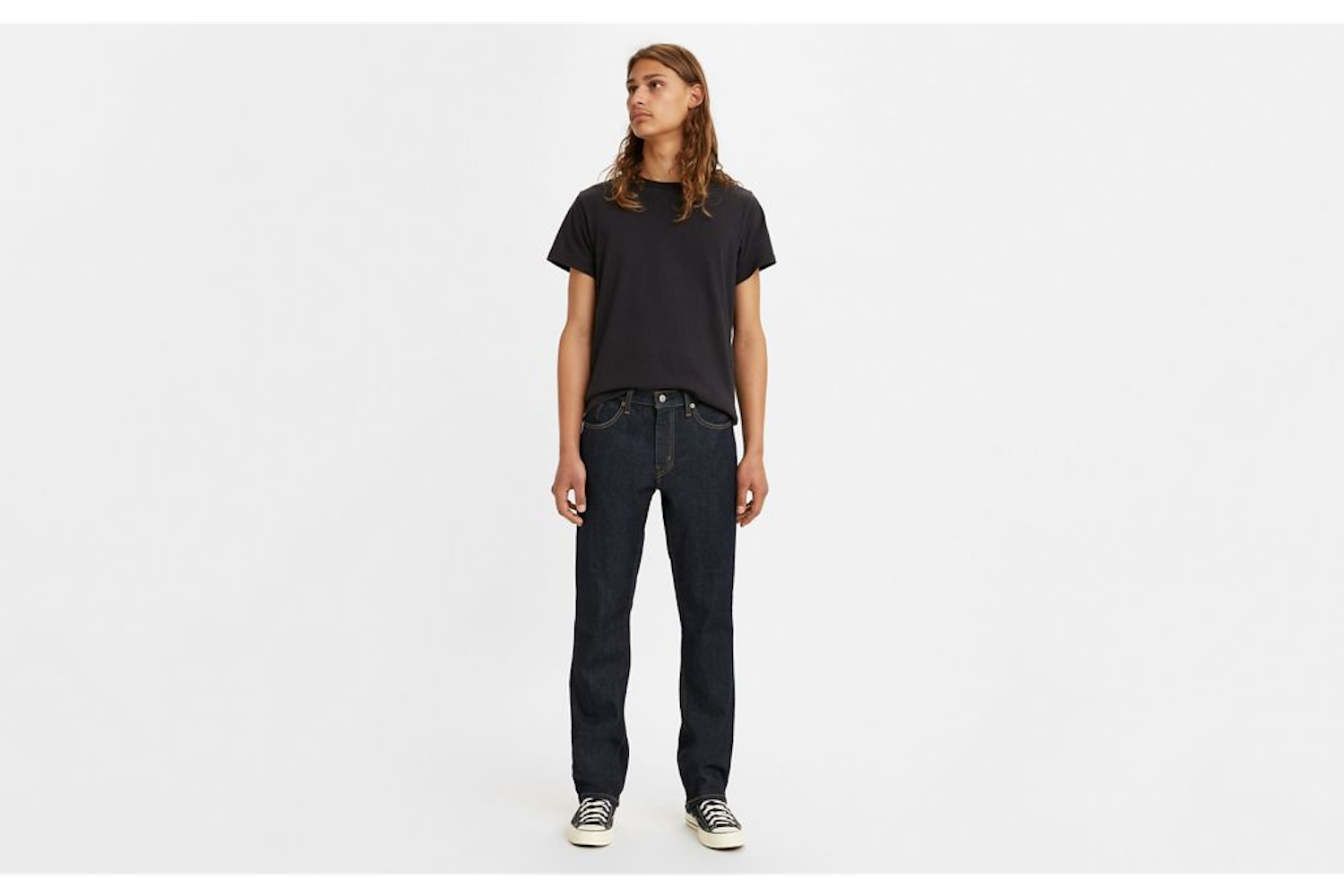 a model in a pair of Levi's jeans on a white background