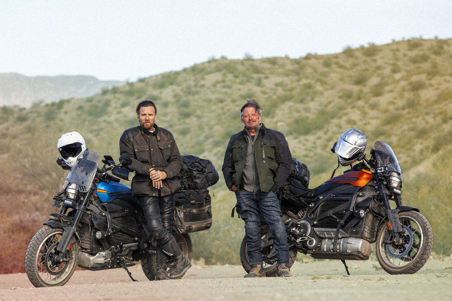 Ewan McGregor and Charley Boorman next to electric Harley-Davidson LiveWire motorcycles in "Long Way Up"