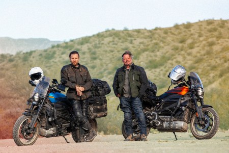 Ewan McGregor and Charley Boorman next to electric Harley-Davidson LiveWire motorcycles in "Long Way Up"