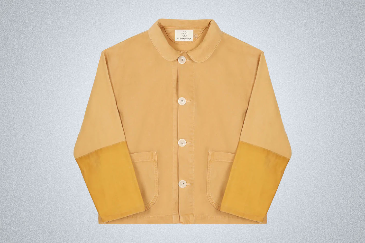 a tan and beige OlderBrother Chore Coat on a grey background
