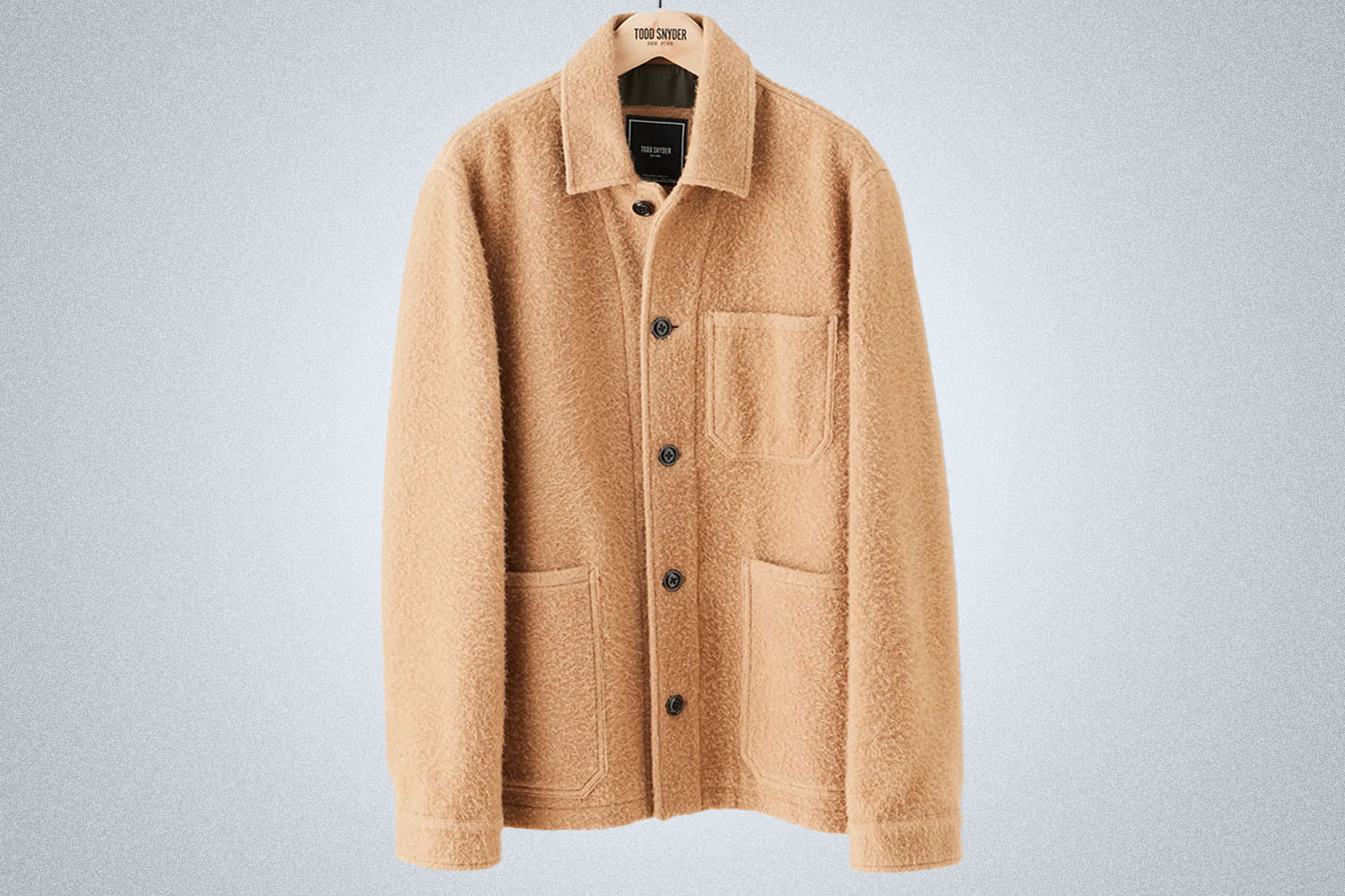 a light tan wool Todd Snyder Chore Coat on a grey background