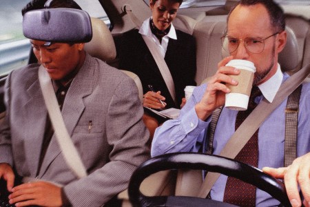 Two men and a woman carpool commuting to work