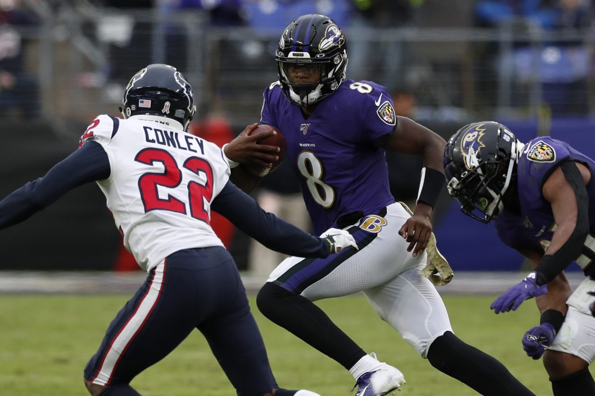 Lamar Jackson of the Ravens carries the ball against the Texans in 2019.