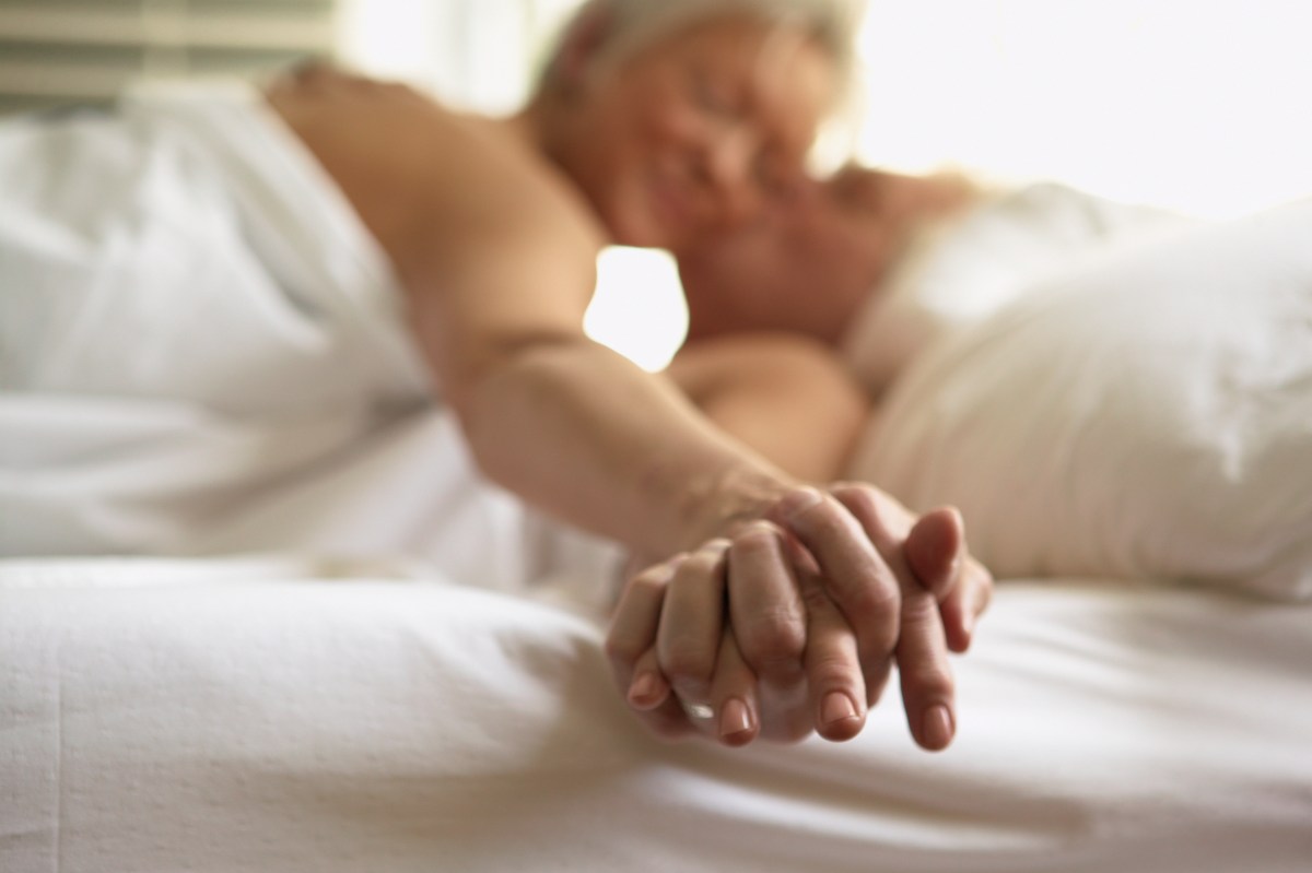 older couple lying in bed